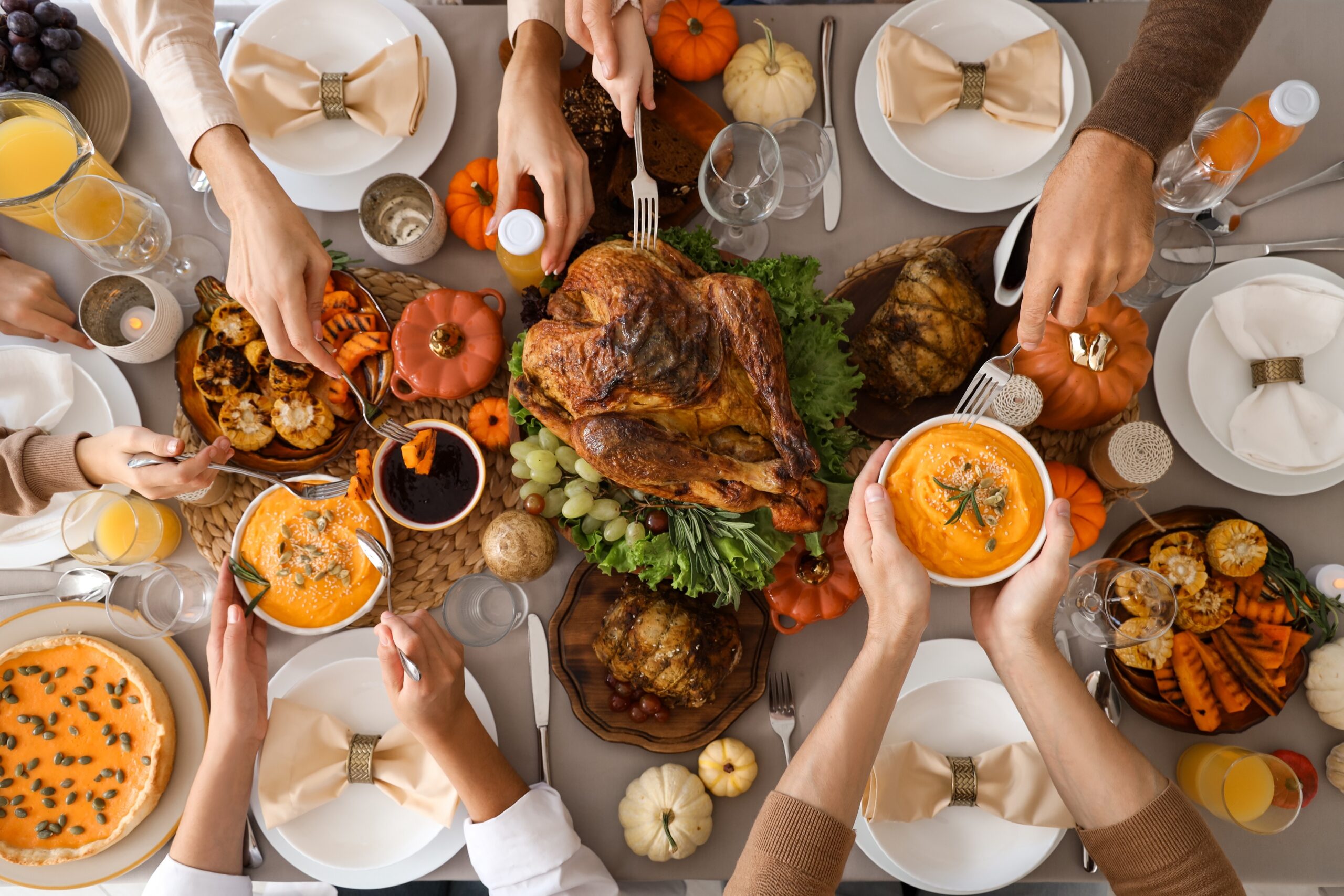 Happy,Family,Having,Dinner,At,Festive,Table,On,Thanksgiving,Day,